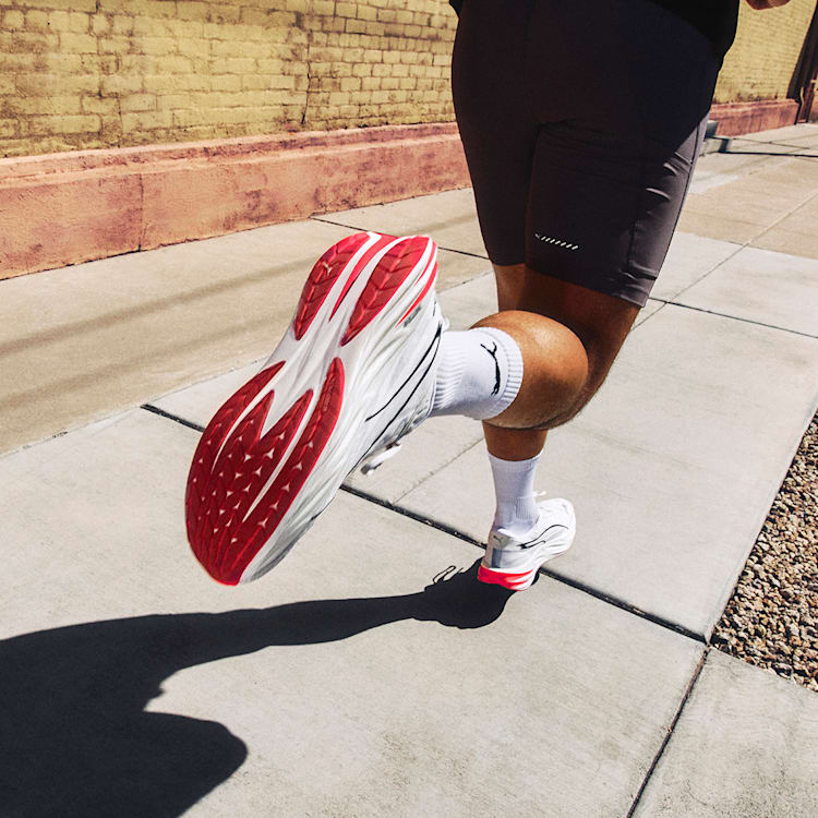 Aerodynamic White Sports Shoes with Red Sole Detail